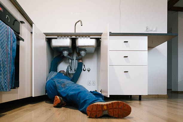 Professional Emergency Plumber technician working in Marne, MI